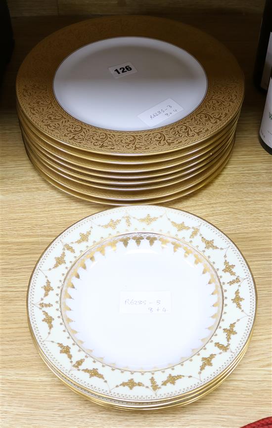 A set of eight Heinrich & Co gilt tooled dinner plates and four other soup bowls